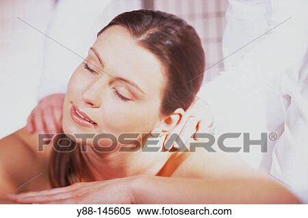 Woman receiving massage View Large Photo Image Stock Photography - Woman receiving massage. Fotosearch
