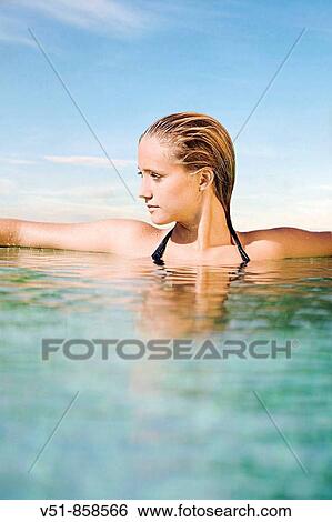 Woman relaxed in a pool View Large Photo Image Stock Photograph - Woman relaxed in a pool. Fotosearch