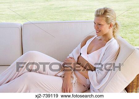 Woman relaxing at home outdoors View Large Photo Image Stock Photo - Woman relaxing at home outdoors. Fotosearch