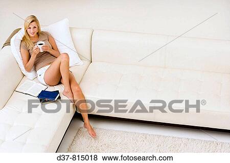 Woman relaxing at home View Large Photo Image Stock Photo - Woman relaxing at home. Fotosearch