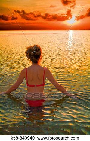 Woman relaxing at sunset on the Costa Dorada, Tarragona, Spain View Large Photo Image Stock Image - Woman relaxing at sunset on the Costa Dorada, Tarragona, Spain. Fotosearch