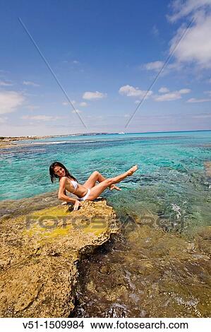 Woman relaxing in a beach in Formentera, Balearic Islands, Spain View Large Photo Image Picture - Woman relaxing in a beach in Formentera, Balearic Islands, Spain. Fotosearch