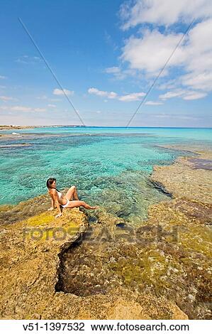 Woman relaxing in a beach in Formentera, Balearic Islands, Spain View Large Photo Image Stock Image - Woman relaxing in a beach in Formentera, Balearic Islands, Spain. Fotosearch