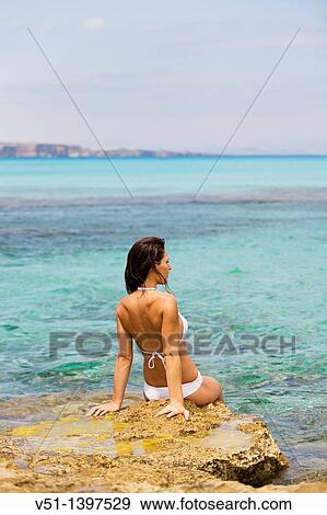 Woman relaxing in a beach in Formentera, Balearic Islands, Spain View Large Photo Image Stock Photo - Woman relaxing in a beach in Formentera, Balearic Islands, Spain. Fotosearch