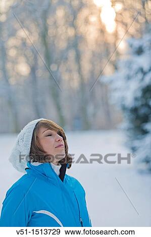 Woman relaxing in a park in Winter View Large Photo Image Stock Photo - Woman relaxing in a park in Winter. Fotosearch
