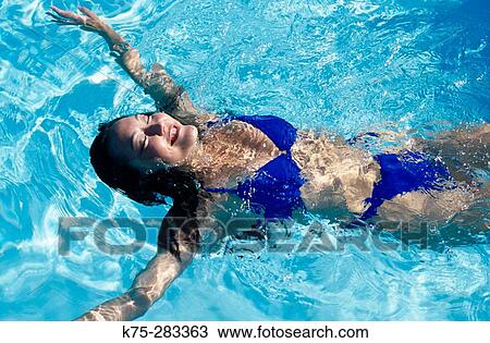 woman relaxing in pool View Large Photo Image Stock Image - woman relaxing in pool. Fotosearch