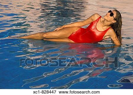 Woman Relaxing in Swimming Pool, Cancun, Mexico View Large Photo Image Stock Photo - Woman Relaxing in Swimming Pool, Cancun, Mexico. Fotosearch