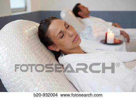 Woman relaxing on hot stone seat, Spa-relais View Large Photo Image Picture - Woman relaxing on hot stone seat, Spa-relais. Fotosearch