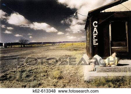 Woman relaxing on steps of cafe on old route 66. New Mexico. USA View Large Photo Image Stock Photo - Woman relaxing on steps of cafe on old route 66. New Mexico. USA. Fotosearch