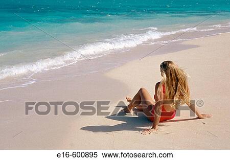 Woman relaxing on the beach View Large Photo Image Stock Photography - Woman relaxing on the beach. Fotosearch
