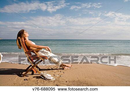 Woman relaxing on the beach, Mediterranean Sea View Large Photo Image Stock Photography - Woman relaxing on the beach, Mediterranean Sea. Fotosearch