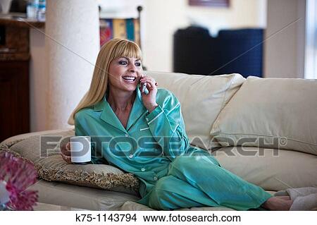 woman relaxing talking on phone View Large Photo Image Picture - woman relaxing talking on phone. Fotosearch