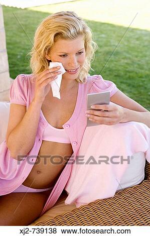 Woman removing make up with cleansing facial wipe View Large Photo Image Stock Photo - Woman removing make up with cleansing facial wipe. Fotosearch