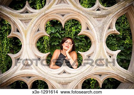 Woman resting by sculpture Hotel de Sully Paris France View Large Photo Image Picture - Woman resting by sculpture Hotel de Sully Paris France. Fotosearch