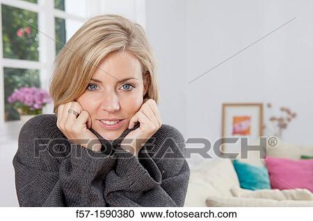 Woman resting her head in her hands View Large Photo Image Stock Image - Woman resting her head in her hands. Fotosearch