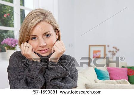 Woman resting her head in her hands View Large Photo Image Stock Image - Woman resting her head in her hands. Fotosearch
