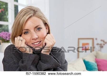 Woman resting her head in her hands View Large Photo Image Stock Image - Woman resting her head in her hands. Fotosearch
