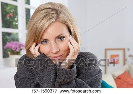 Woman resting her head in her hands View Large Photo Image Stock Photo - Woman resting her head in her hands. Fotosearch
