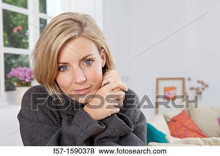 Woman resting her head in her hands View Large Photo Image Stock Photo - Woman resting her head in her hands. Fotosearch