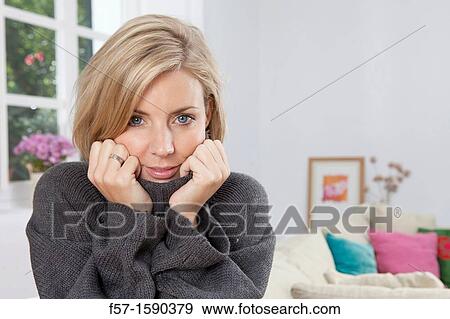Stock Photo - Woman resting her head in her hands. Fotosearch