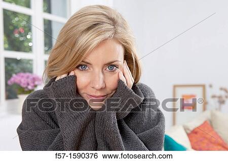 Woman resting her head in her hands View Large Photo Image Stock Photograph - Woman resting her head in her hands. Fotosearch