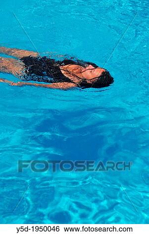 woman resting in swimming pool, summertime View Large Photo Image Stock Photograph - woman resting in swimming pool, summertime. Fotosearch