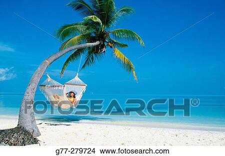 Woman resting on a beach. White Sands Resort and Spa. Ari Atoll, Maldives View Large Photo Image Picture - Woman resting on a beach. White Sands Resort and Spa. Ari Atoll, Maldives. Fotosearch