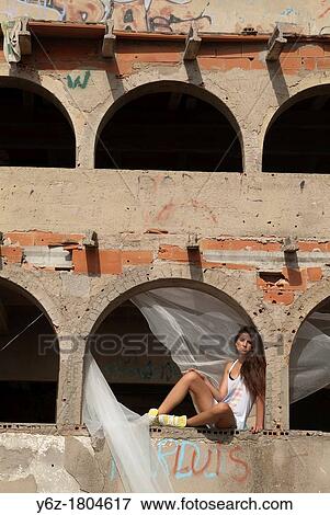 Stock Photo - Woman resting on the windowsill. Fotosearch