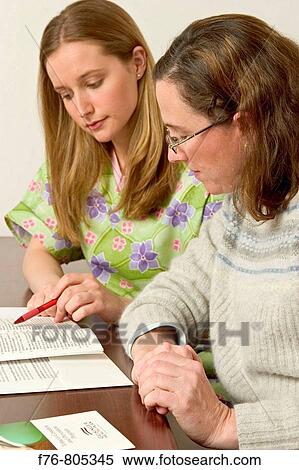 Woman, reviewing health plan options with medical technician or nurse, at medical office View Large Photo Image Stock Photography - Woman, reviewing health plan options with medical technician or nurse, at medical office. Fotosearch