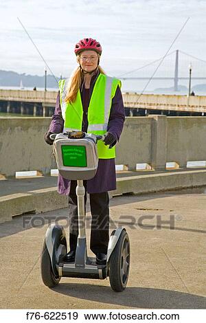 Woman riding Segway Personal transportation device in San Francisco, CA. USA. View Large Photo Image Stock Photo - Woman riding Segway Personal transportation device in San Francisco, CA. USA.. Fotosearch