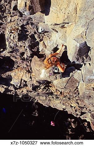 Woman rock climbing a route called Sanitary Landfill which is rated 5, 10 and located in The Alcove Area at Dierkes Lake Idaho USA View Large Photo Image Stock Photo - Woman rock climbing a route called Sanitary Landfill which is rated 5, 10 and located in The Alcove Area at Dierkes Lake Idaho USA. Fotosearch