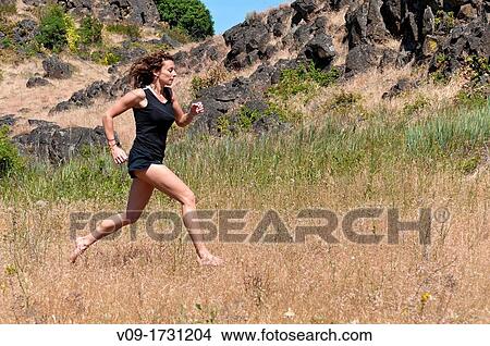 Woman running barefoot View Large Photo Image Picture - Woman running barefoot. Fotosearch