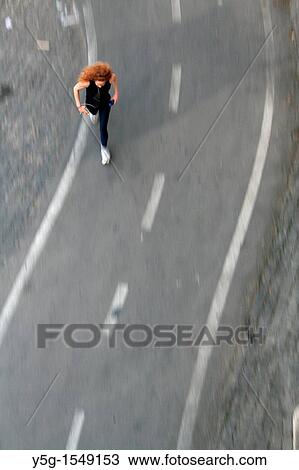 woman running on cycle path View Large Photo Image Stock Image - woman running on cycle path. Fotosearch