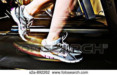 WOMAN RUNNING ON TREADMILL View Large Photo Image Stock Image - WOMAN RUNNING ON TREADMILL. Fotosearch