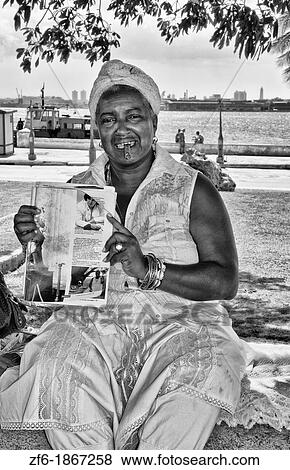 Woman Santeria religion in white tarot card reader in Regla area of Havana Cuba View Large Photo Image Stock Photo - Woman Santeria religion in white tarot card reader in Regla area of Havana Cuba. Fotosearch