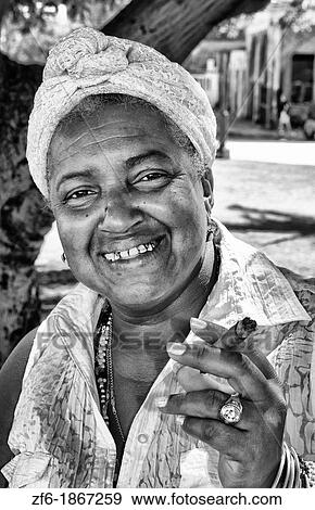 Woman Santeria religion in white tarot card reader in Regla area of Havana Cuba View Large Photo Image Stock Photo - Woman Santeria religion in white tarot card reader in Regla area of Havana Cuba. Fotosearch