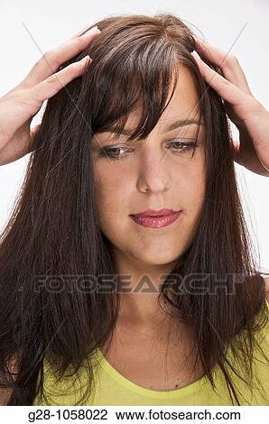 woman scratching her itching scalp skin View Large Photo Image Stock Image - woman scratching her itching scalp skin. Fotosearch