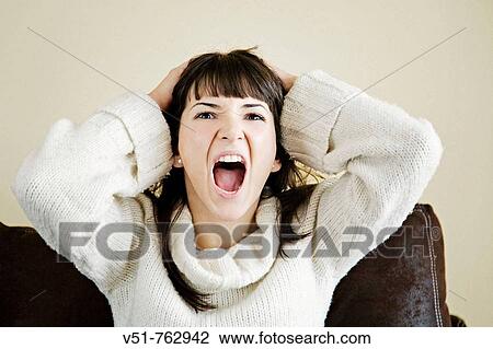 Woman screaming at home View Large Photo Image Stock Image - Woman screaming at home. Fotosearch