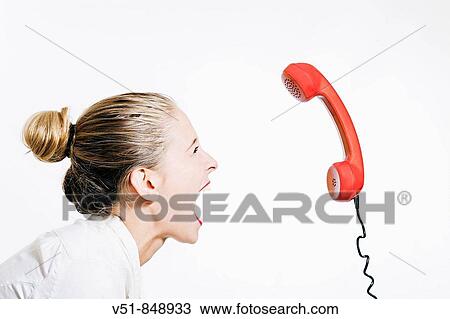 Stock Image - Woman screaming, desperate because of the stress. Fotosearch