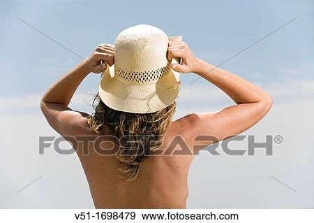 Stock Photo - woman, sea, back, young adult. Fotosearch