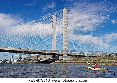 Woman sea kayaking by the Highway 509 bridge, Tacoma, Washington View Large Photo Image Stock Image - Woman sea kayaking by the Highway 509 bridge, Tacoma, Washington. Fotosearch