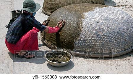 Woman seals traditional circular woven coracle boats Cham Island off historic Hoi An Vietnam View Large Photo Image Stock Photo - Woman seals traditional circular woven coracle boats Cham Island off historic Hoi An Vietnam. Fotosearch