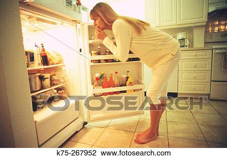 woman searching in the refrigerator View Large Photo Image Stock Image - woman searching in the refrigerator. Fotosearch