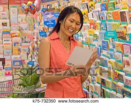 Woman selecting greeting card View Large Photo Image Stock Image - Woman selecting greeting card. Fotosearch