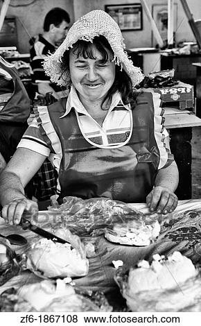 Woman selling cheese at indoor market in city center of Lviv Ukraine View Large Photo Image Stock Photo - Woman selling cheese at indoor market in city center of Lviv Ukraine. Fotosearch
