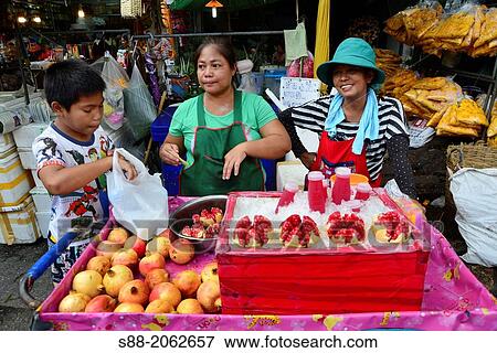 Woman selling Pomegranate at the market. View Large Photo Image Stock Photo - Woman selling Pomegranate at the market.. Fotosearch