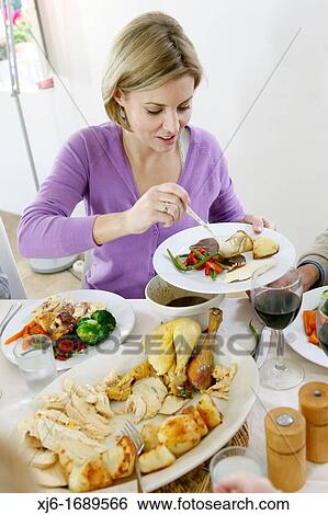 Woman serving dinner View Large Photo Image Stock Photograph - Woman serving dinner. Fotosearch