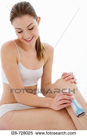 Stock Photography - woman shaving legs. Fotosearch