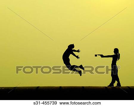 Stock Photo - Woman shooting a toy gun on a man who is caught in mid air grimmacing as if shot. Fotosearch