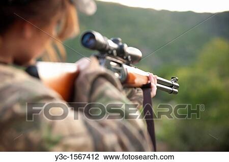 Woman shooting hunting rifle View Large Photo Image Stock Image - Woman shooting hunting rifle. Fotosearch